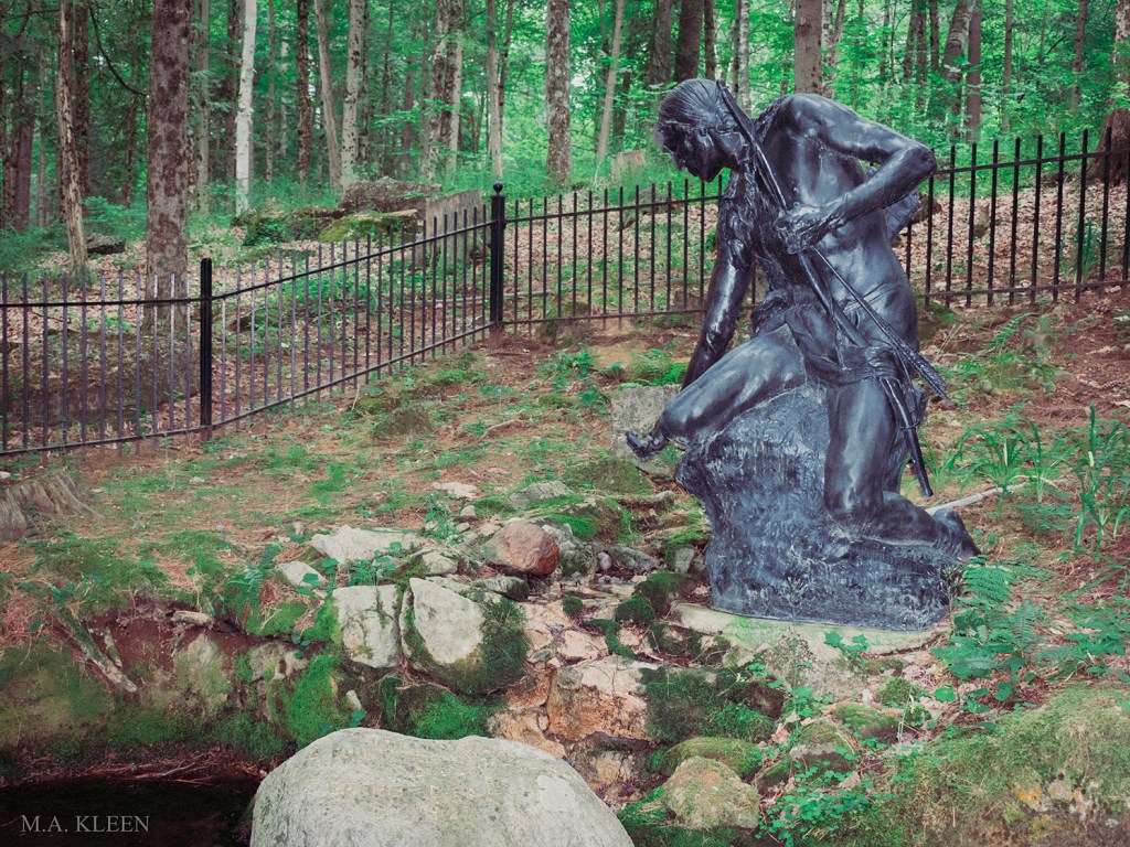 This bronze statue of a Mohawk brave reaching to take a drink of water from a spring sits in Lake George Battlefield Park in Warren County, New York.